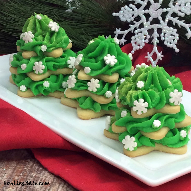 stacked Christmas tree sugar cookies with green icing