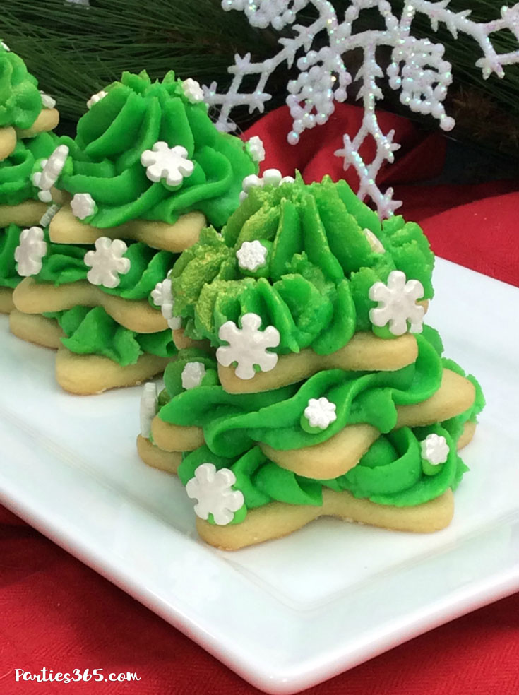 stacked Christmas tree sugar cookies with green icing