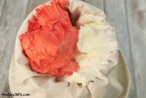 Looking for Christmas Cupcake ideas for the holidays? Our Holly Cupcake Recipe is a fancy dessert that's still easy to make! The cute fondant leaves and M&M berries really stand out on the candy cane inspired frosting. Click for the full recipe! #holidaybaking #holidayrecipes #Christmas