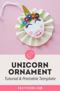 This cute DIY paper unicorn ornament for Christmas will look adorable on the tree and is fun for all ages! Our tutorial and printable template will show you how to make the ornaments - let the glitter and creativity run wild! #Christmascraft #unicorns #printable #crafts