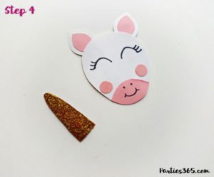 This cute DIY paper unicorn ornament for Christmas will look adorable on the tree and is fun for all ages! Our tutorial and printable template will show you how to make the ornaments - let the glitter and creativity run wild! #Christmascraft #unicorns #printable #crafts