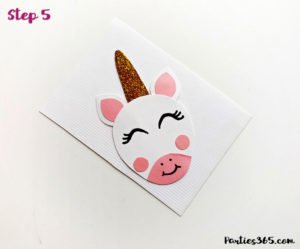 This cute DIY paper unicorn ornament for Christmas will look adorable on the tree and is fun for all ages! Our tutorial and printable template will show you how to make the ornaments - let the glitter and creativity run wild! #Christmascraft #unicorns #printable #crafts