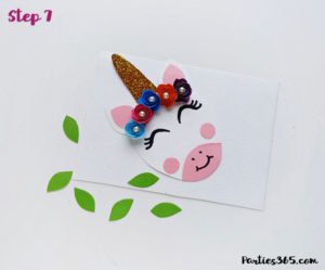 This cute DIY paper unicorn ornament for Christmas will look adorable on the tree and is fun for all ages! Our tutorial and printable template will show you how to make the ornaments - let the glitter and creativity run wild! #Christmascraft #unicorns #printable #crafts