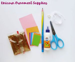 This cute DIY paper unicorn ornament for Christmas will look adorable on the tree and is fun for all ages! Our tutorial and printable template will show you how to make the ornaments - let the glitter and creativity run wild! #Christmascraft #unicorns #printable #crafts