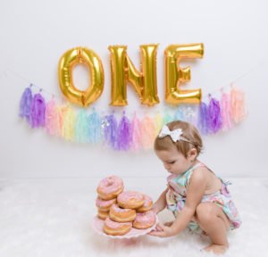 A donut themed party is a sweet idea for a 1st birthday, baby shower or girls birthday party! Check out this Donut Grow Up party for some decorations, food, cake and other theme ideas! #firstbirthday #donuts #donutparty #birthday