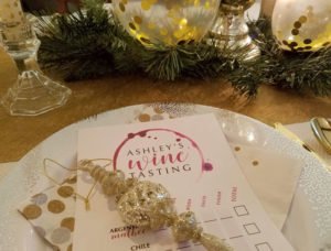 I topped each place setting with a custom designed wine tasting card (more on those in a minute) and a glittery gold ornament for each guest to take home as a party favor.