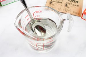 Want a fun treat for your lego themed birthday party? Let us show you how to make colorful Jello Lego blocks and figurines with this easy recipe and mold! #legos #legoparty #legofood #birthday #partyfood