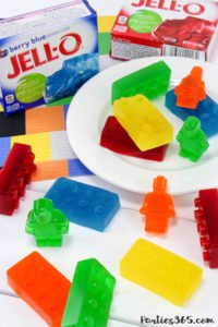 Want a fun treat for your lego themed birthday party? Let us show you how to make colorful Jello Lego blocks and figurines with this easy recipe and mold! #legos #legoparty #legofood #birthday #partyfood