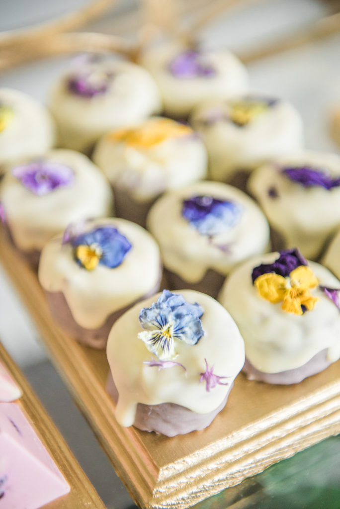 edible flowers on purple donuts