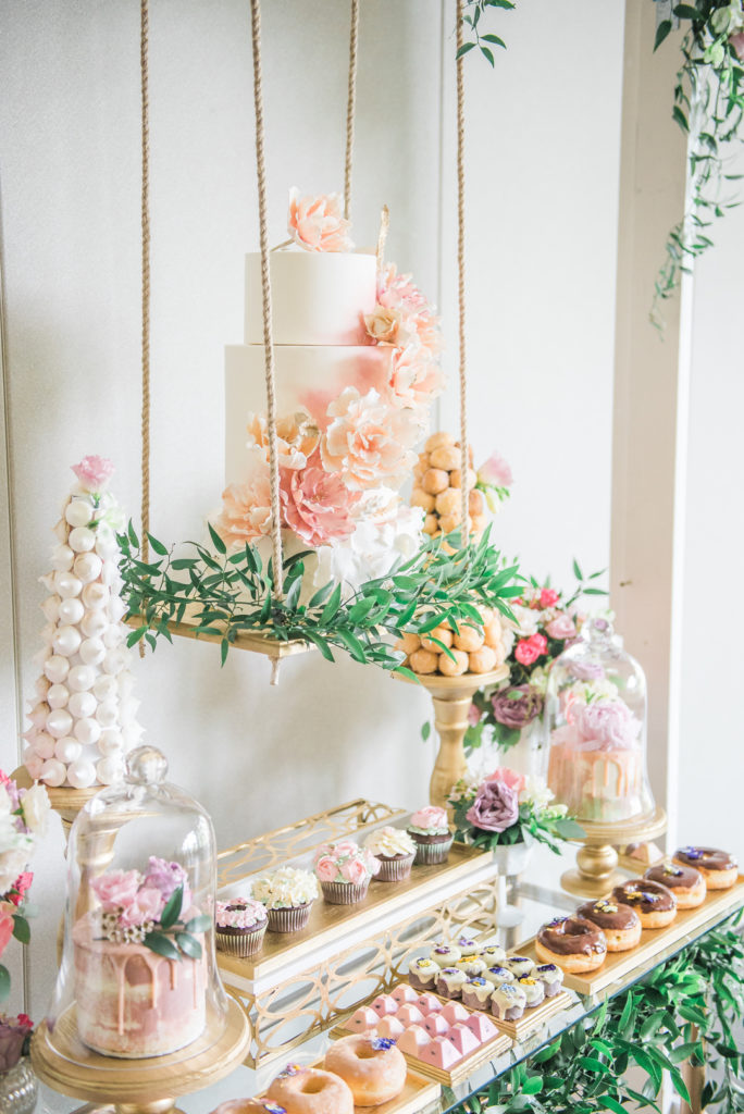 spring garden party cake swing and dessert table