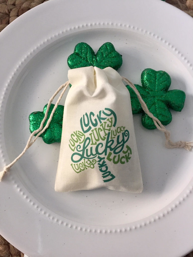 St. Patrick's Day shamrock favor bag on white plate