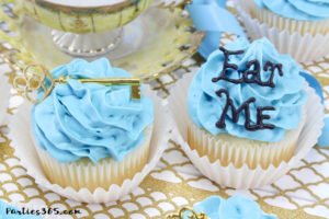 These simple DIY cupcake toppers are perfect for your Alice in Wonderland theme party! The gold key and "Eat Me" decorations are easy ideas to make your party food whimsical and fun for all ages! #AliceinWonderland #cupcakes #TeaPartyIdeas