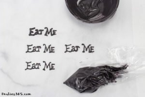 These simple DIY cupcake toppers are perfect for your Alice in Wonderland theme party! The gold key and "Eat Me" decorations are easy ideas to make your party food whimsical and fun for all ages! #AliceinWonderland #cupcakes #TeaPartyIdeas