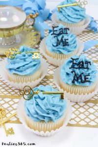 These simple DIY cupcake toppers are perfect for your Alice in Wonderland theme party! The gold key and "Eat Me" decorations are easy ideas to make your party food whimsical and fun for all ages! #AliceinWonderland #cupcakes #TeaPartyIdeas