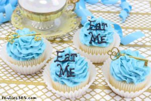These simple DIY cupcake toppers are perfect for your Alice in Wonderland theme party! The gold key and "Eat Me" decorations are easy ideas to make your party food whimsical and fun for all ages! #AliceinWonderland #cupcakes #TeaPartyIdeas
