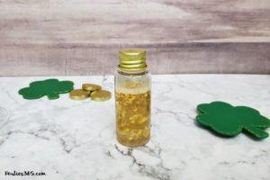 This festive St. Patrick's Day champagne cocktail is a fun and easy drink idea for your party! The simple recipe with sparkling wine, isn't green, but the gold under the rainbow will delight any St. Pattys leprechaun! #stpatricksday #champagne #cocktailrecipe #rainbow