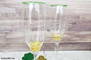This festive St. Patrick's Day champagne cocktail is a fun and easy drink idea for your party! The simple recipe with sparkling wine, isn't green, but the gold under the rainbow will delight any St. Pattys leprechaun! #stpatricksday #champagne #cocktailrecipe #rainbow