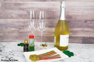 This festive St. Patrick's Day champagne cocktail is a fun and easy drink idea for your party! The simple recipe with sparkling wine, isn't green, but the gold under the rainbow will delight any St. Pattys leprechaun! #stpatricksday #champagne #cocktailrecipe #rainbow