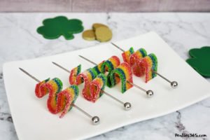 This festive St. Patrick's Day champagne cocktail is a fun and easy drink idea for your party! The simple recipe with sparkling wine, isn't green, but the gold under the rainbow will delight any St. Pattys leprechaun! #stpatricksday #champagne #cocktailrecipe #rainbow