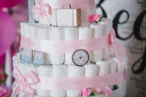 A travel themed baby shower is a perfect idea as the adventure into parenthood begins! Get ideas from vintage maps to custom invitations, favors, decorations and even creative food in this beautiful baby shower held in an airplane hanger! #babyshower #travel #adventuretheme #partyideas