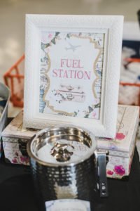 A travel themed baby shower is a perfect idea as the adventure into parenthood begins! Get ideas from vintage maps to custom invitations, favors, decorations and even creative food in this beautiful baby shower held in an airplane hanger! #babyshower #travel #adventuretheme #partyideas