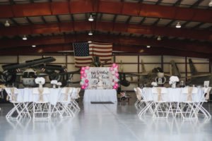 A travel themed baby shower is a perfect idea as the adventure into parenthood begins! Get ideas from vintage maps to custom invitations, favors, decorations and even creative food in this beautiful baby shower held in an airplane hanger! #babyshower #travel #adventuretheme #partyideas