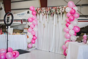 A travel themed baby shower is a perfect idea as the adventure into parenthood begins! Get ideas from vintage maps to custom invitations, favors, decorations and even creative food in this beautiful baby shower held in an airplane hanger! #babyshower #travel #adventuretheme #partyideas