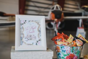 A travel themed baby shower is a perfect idea as the adventure into parenthood begins! Get ideas from vintage maps to custom invitations, favors, decorations and even creative food in this beautiful baby shower held in an airplane hanger! #babyshower #travel #adventuretheme #partyideas