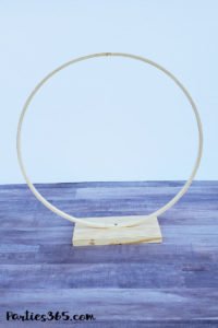 This unique DIY centerpiece, made from an Embroidery Hoop, flowers and mini balloons, is perfect for a party, birthday, wedding, graduation or anniversary! This simple crafts project tutorial will show you how to create beautiful decor for your big event! #centerpiece #embroideryhoop #partydecor #partyideas