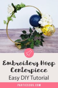 This unique DIY centerpiece, made from an Embroidery Hoop, flowers and mini balloons, is perfect for a party, birthday, wedding, graduation or anniversary! This simple crafts project tutorial will show you how to create beautiful decor for your big event! #centerpiece #embroideryhoop #partydecor #partyideas