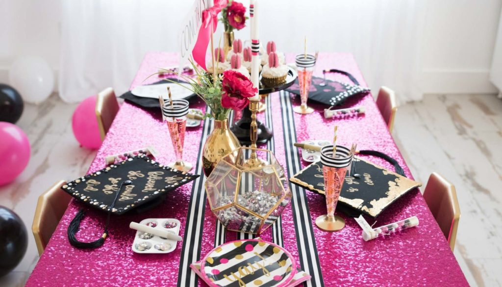 pink, black and gold table decorations for graduation party