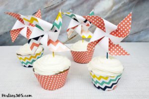 This pinwheel theme for a Sweet Shoppe is full of printable designs to make your birthday party pop! With ideas for decorations, favors, cupcake toppers, signs and more, you'll definitely want to download this free printable party set! #pinwheel #sweetshoppe #printables #partyideas