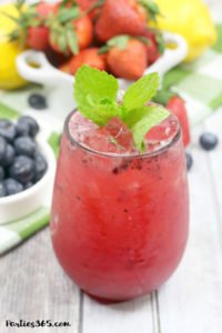 This Bourbon Berry Lemonade cocktail is an easy spring drink that will please a crowd! Get the simple cocktail recipe, made with fresh strawberries and blueberries for your next summer party! #bourbon #cocktail #drinkrecipe #springparty #summer