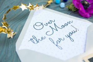 Looking for the perfect baby shower theme? An Over the Moon shower lends itself to so many great ideas for a baby girl or boy! Check out this darling Over the Moon shower for ideas for invitations, food, decorations and other themed products to make yours a shower to remember! #overthemoon #babyshower #babyshowerideas #babyshowerthemes