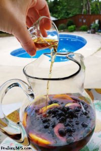 Want a fun boozy summer popsicle for the adults at your party? These Sangria Popsicles are the bomb! Red wine, fresh berries and bourbon combine into the perfect frozen cocktail recipe for mom! #sangria #popsicles #boozypopsicles #sangriarecipe #icepops