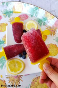 Want a fun boozy summer popsicle for the adults at your party? These Sangria Popsicles are the bomb! Red wine, fresh berries and bourbon combine into the perfect frozen cocktail recipe for mom! #sangria #popsicles #boozypopsicles #sangriarecipe #icepops