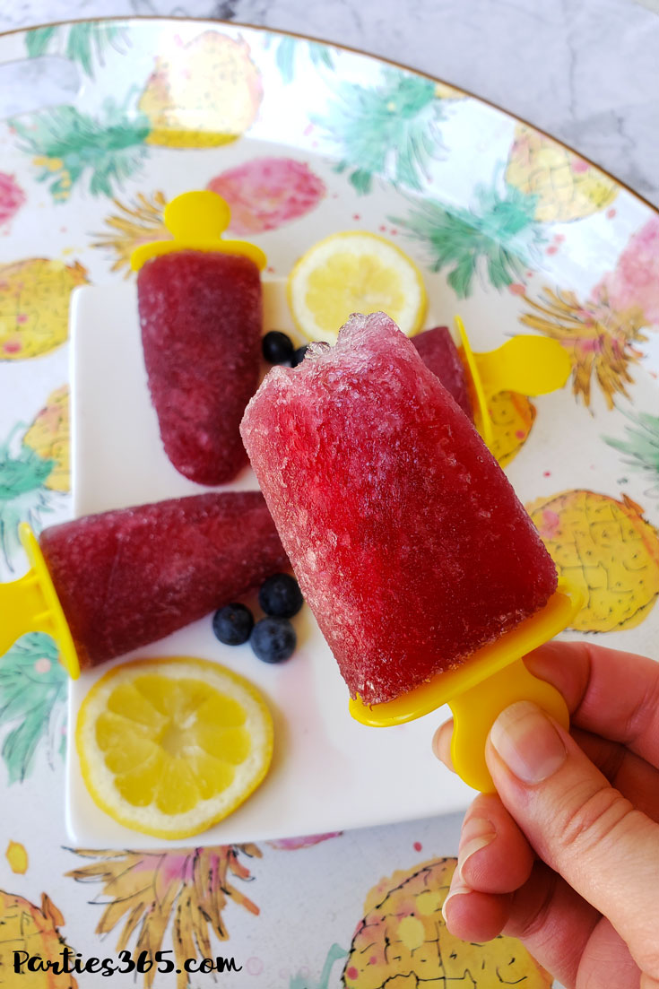 frozen red wine sangria popsicle with a bite out of it