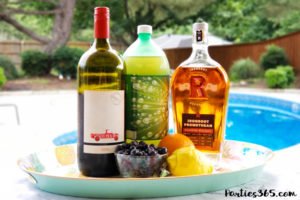 Want a fun boozy summer popsicle for the adults at your party? These Sangria Popsicles are the bomb! Red wine, fresh berries and bourbon combine into the perfect frozen cocktail recipe for mom! #sangria #popsicles #boozypopsicles #sangriarecipe #icepops