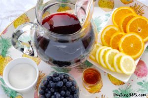 Want a fun boozy summer popsicle for the adults at your party? These Sangria Popsicles are the bomb! Red wine, fresh berries and bourbon combine into the perfect frozen cocktail recipe for mom! #sangria #popsicles #boozypopsicles #sangriarecipe #icepops