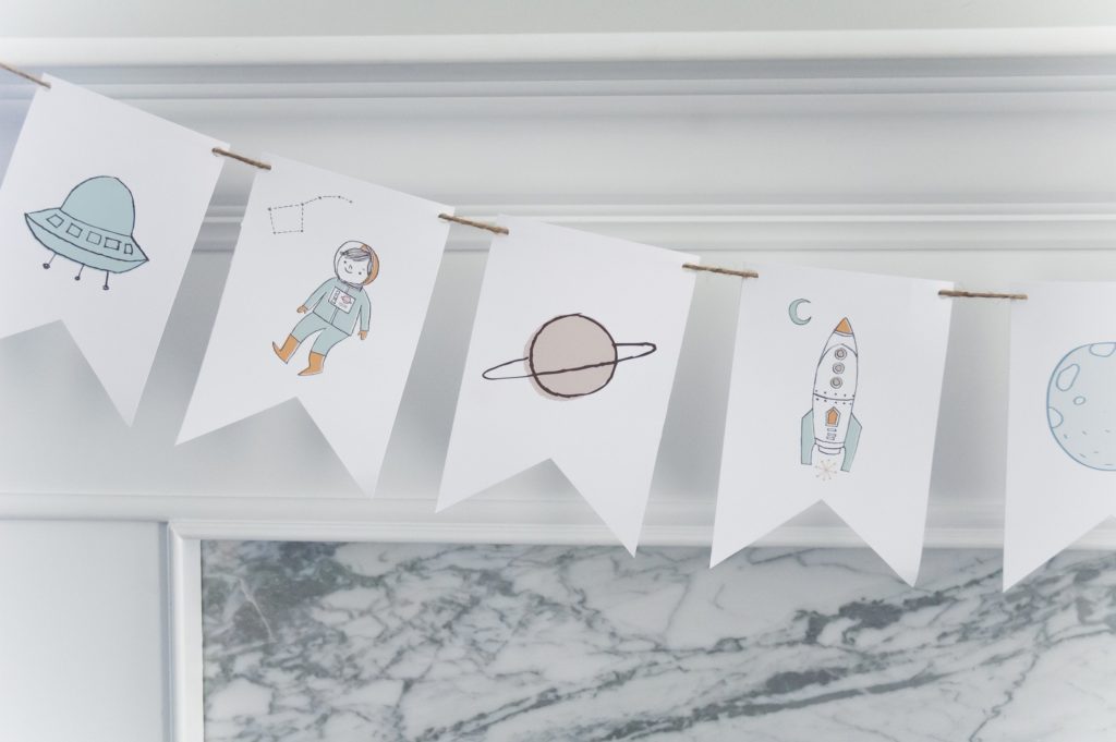 astronaut and space party banner