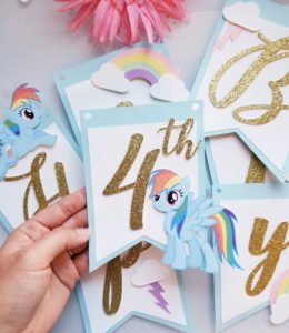 Throw a fabulous My Little Pony Birthday Party for your daughter and her friends with these ideas for a backyard, DIY celebration! Find inspiration for decorations, cake, food, banner, favors and more in this rainbow colored pony party! #mylittlepony #birthdayparty #partyideas #mylittleponyparty