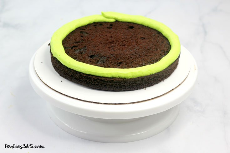 chocolate cake layer with electric green icing
