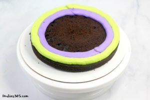 This easy and fun Halloween Monster Cake is a cute idea for kids this fall! Our DIY recipe is simple to follow and you'll create a spooky and amazing monster cake everyone will adore! #Halloween #halloweenrecipes #halloweencake #monster #monstercake