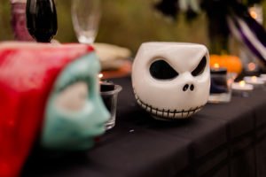 This Jack and Sally, Nightmare Before Christmas inspired Halloween Tablescape is full of decoration ideas for your spooky party or event! With Halloween table settings, centerpieces and display ideas, you'll love recreating this unique table for your guests! #JackandSally #NightmareBeforeChristmas #halloween #tablescape