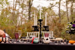 This Jack and Sally, Nightmare Before Christmas inspired Halloween Tablescape is full of decoration ideas for your spooky party or event! With Halloween table settings, centerpieces and display ideas, you'll love recreating this unique table for your guests! #JackandSally #NightmareBeforeChristmas #halloween #tablescape