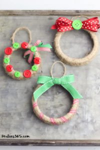 This easy DIY Christmas Mason Jar Lid Wreath craft idea is the perfect ornament for kids to make! It's perfect for teachers, for the tree, for gifts or just as a fun winter project! Instructions and supplies are right here... #christmasornament #christmascraft #christmasDIY #masonjar #masonjarlid