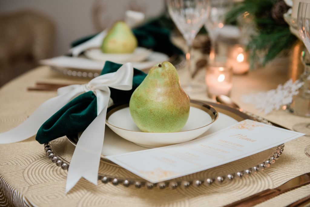 vintage Christmas place setting ideas in cream and green with a pear