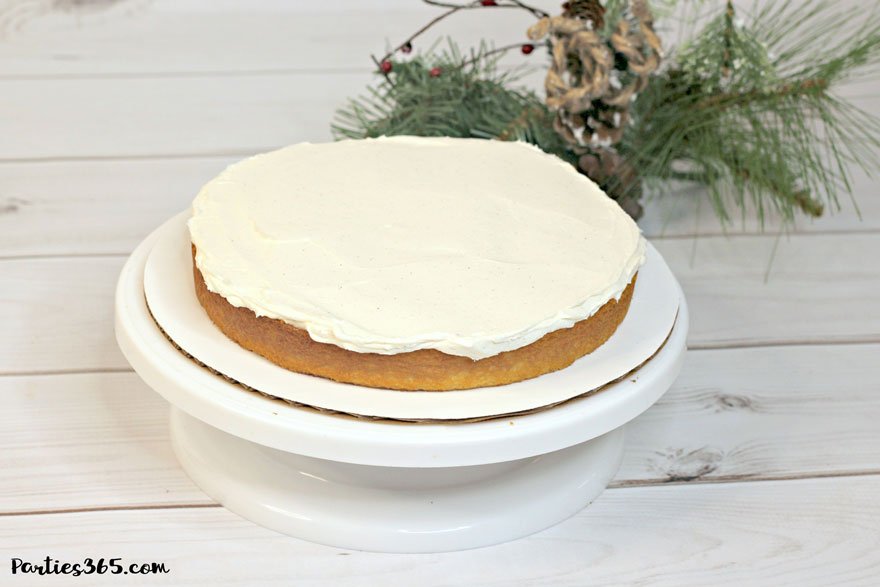 eggnog cake layer being iced