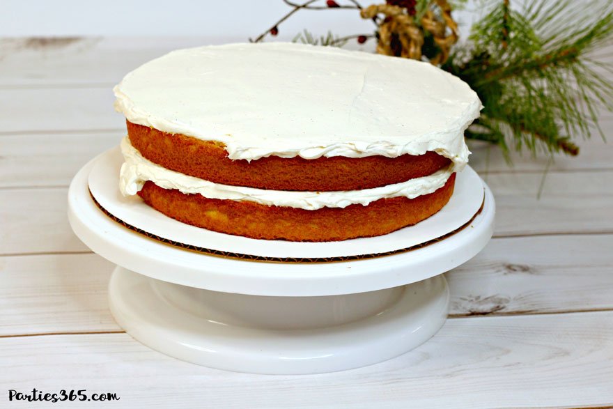 eggnog cake layer being iced