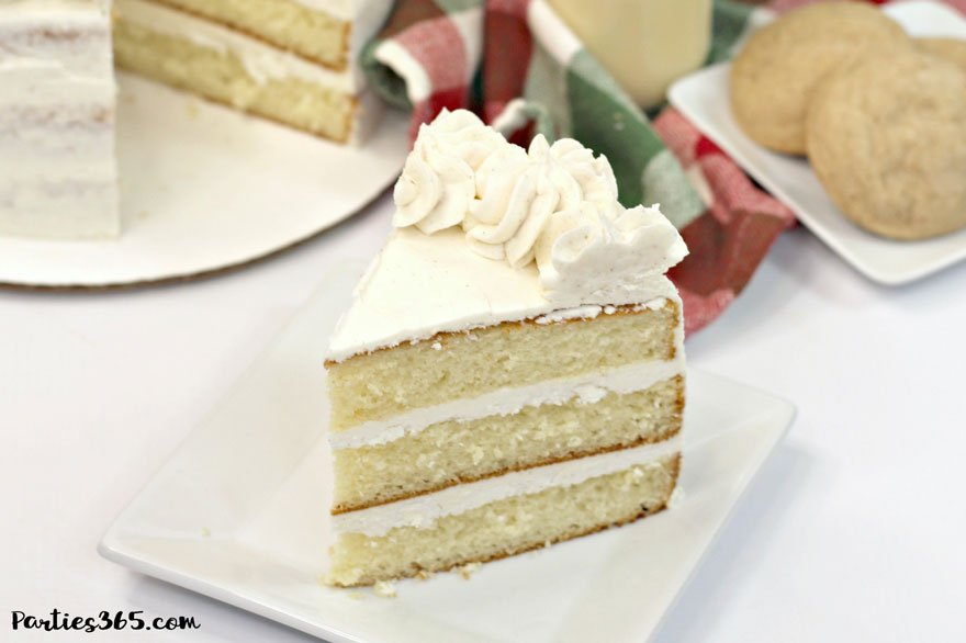 slice of Christmas eggnog cake on white plate